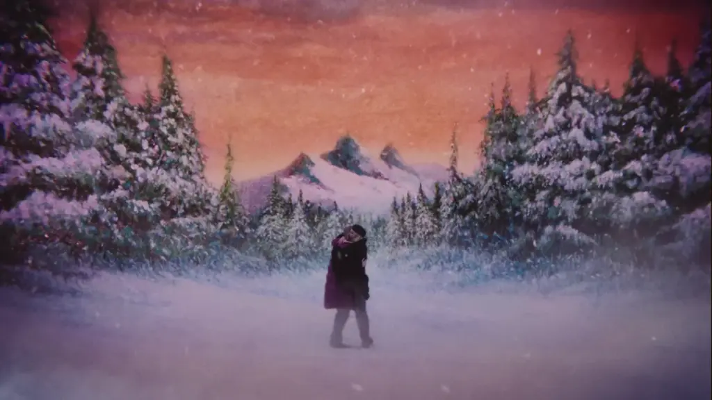 Hannah Einbinder and Gillian Anderson embrace each other with a powerful hug in the middle of a large snowy forest backdrop that looks like a beautiful painting in TEENAGE SEX AND DEATH AT CAMP MIASMA.