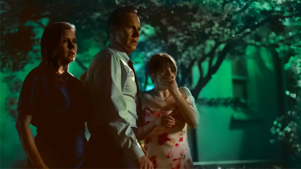 Amy Adams, Patrick Wilson, and Lily Collias star as the Bowden family standing together in total fear and shock in CAPE FEAR on Apple TV+. 