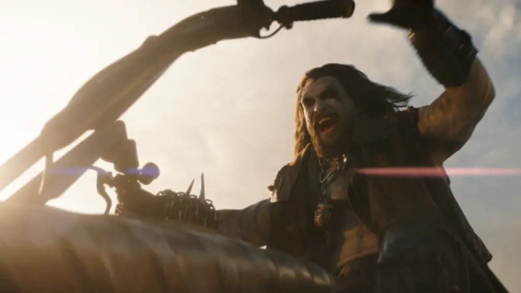 Jason Momoa stars as the alien bounty hunter Lobo riding his signature spacehog motorcycle in the SUPERGIRL film.