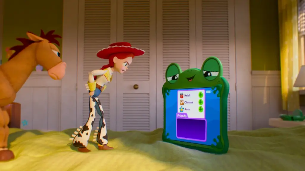 Jessie the cowgirl meets Lilypad the tablet device for the first time on top of Bonnie's bed in TOY STORY 5. 