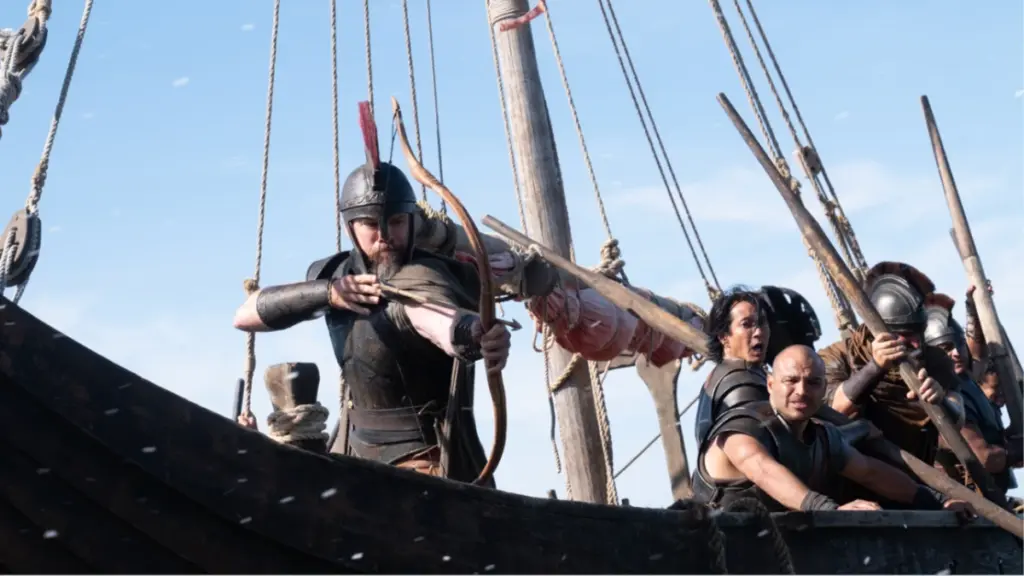 An epic shot of Odysseus, played by Matt Damon, firing an arrow from his war ship in Christopher Nolan's movie adaptation of THE ODYSSEY. 