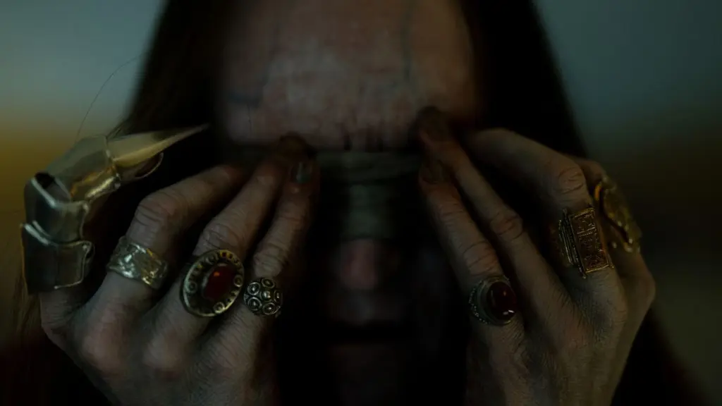 Sam Spruell stars as the evil demonic cult leader Cyrus showing off his rings and finger blade in INSIDIOUS: OUT OF THE FURTHER.