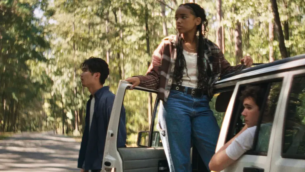 Four Friends played by Phinehas Yoon, Akira Jackson, Noah Toth, and Mitchell Cole gather around a car for a road trip in the indie horror movie IT ENDS.