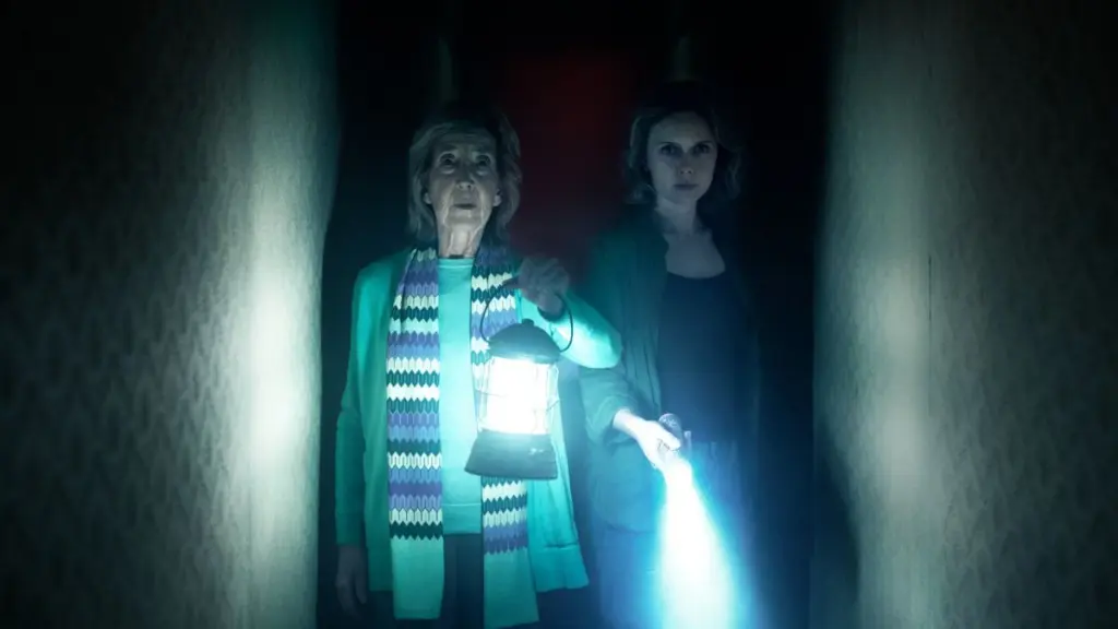 Lin Shaye returns as astral plane investigator Elise Rainier guiding new character Gemma, played by Amelia Eve, through the Further in INSIDIOUS 6.