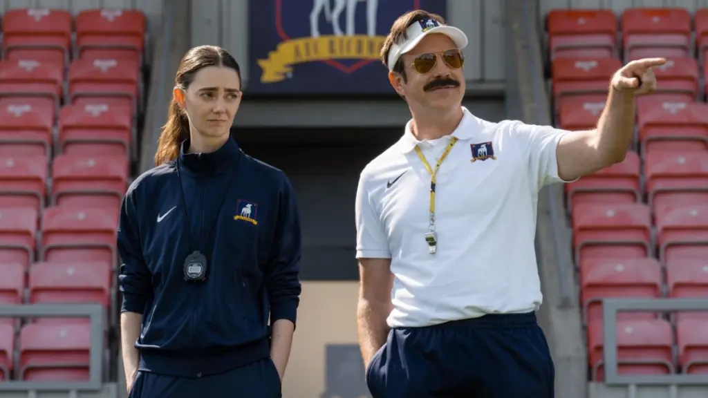 Tanya Reynolds and Jason Sudeikis star as Lady Greyhounds assistant coach Alice Chilton and head coach Ted Lasso in Season 4 of the Apple TV series.