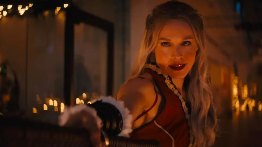 Kristen Bell strikes an epic battle pose as Mrs. Claus while entering a fight scene in VIOLENT NIGHT 2. 